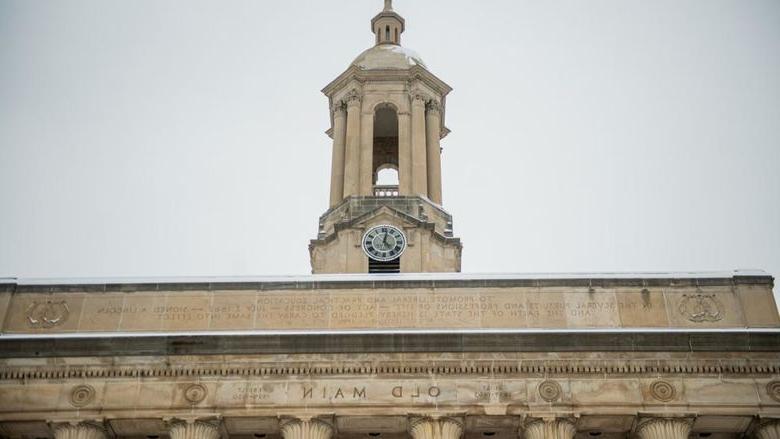 Tower of campus building with grey skies in background.